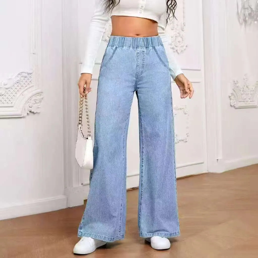 Women's light blue washed wide-leg jeans with straight cut trousers and mid-waist zip fly