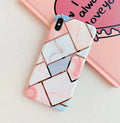 Clear transparent silicone mobile phone case for iPhone on a table.