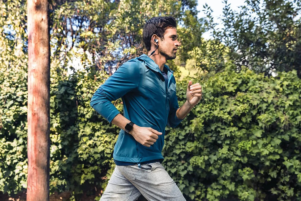 Black waterproof smart watch with heart rate monitoring on a silicone wrist strap.