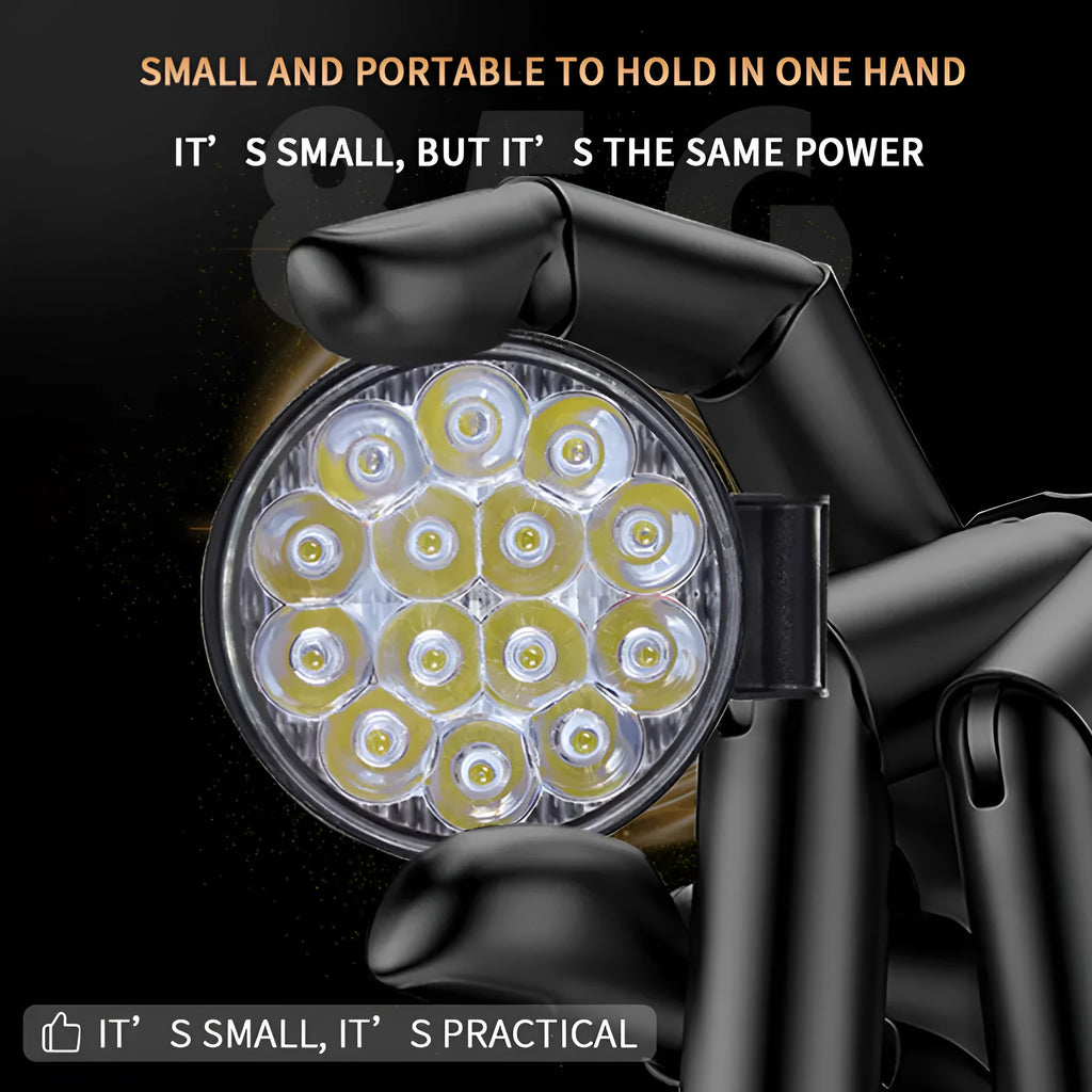 White mini round LED work light with aluminium housing, mounted as an auxiliary car or truck light.