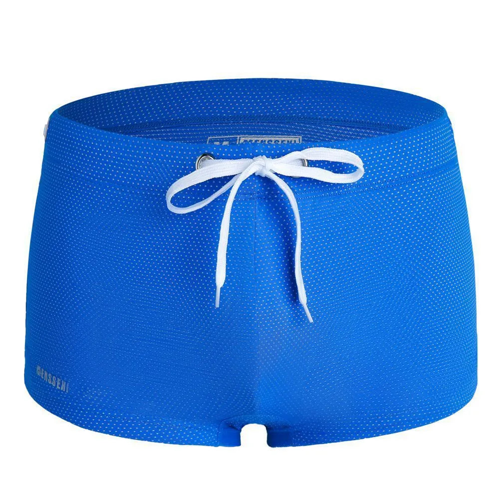 Men's low waist nylon swimming trunks in a solid colour with a boxer brief design.