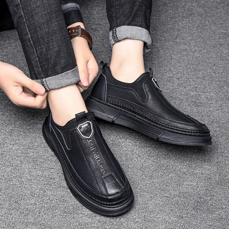 Men's solid colour leather casual shoes with round toe in black and brown on a white background.