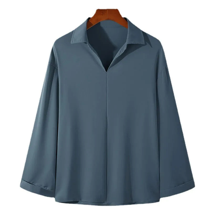 Men's loose lapel casual shirt in solid colour on a hanger, showing long sleeves and pullover style.