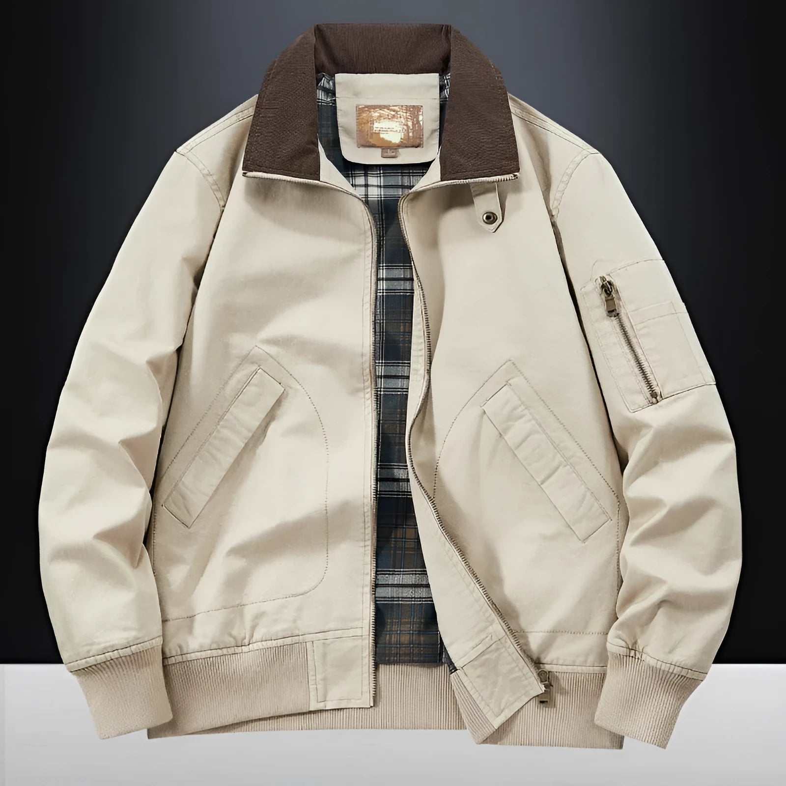 Men's beige washed cotton flight jacket on a hanger, showing its simple design and cotton fabric texture.