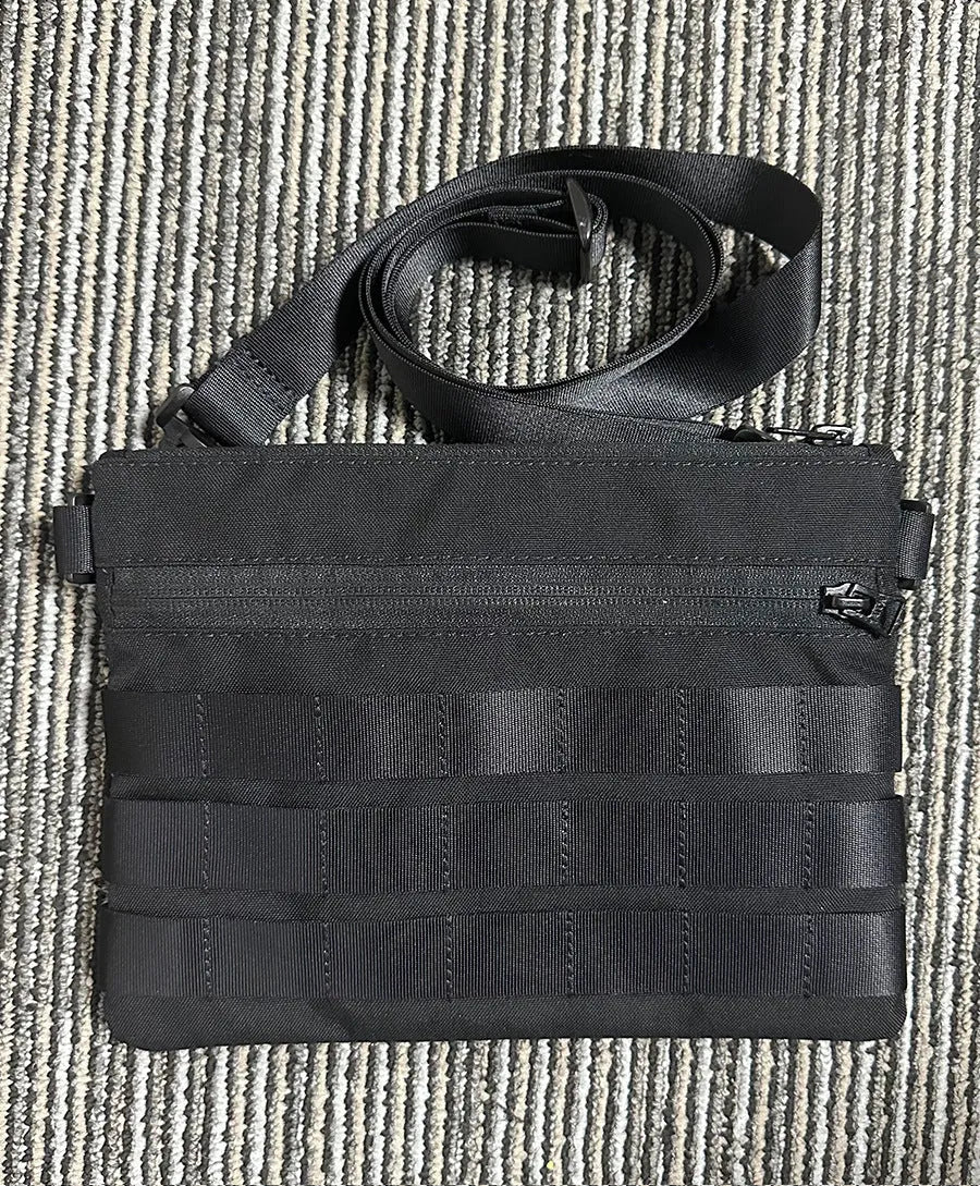 Black Oxford cloth military-style outdoor tactical bag, compact size.