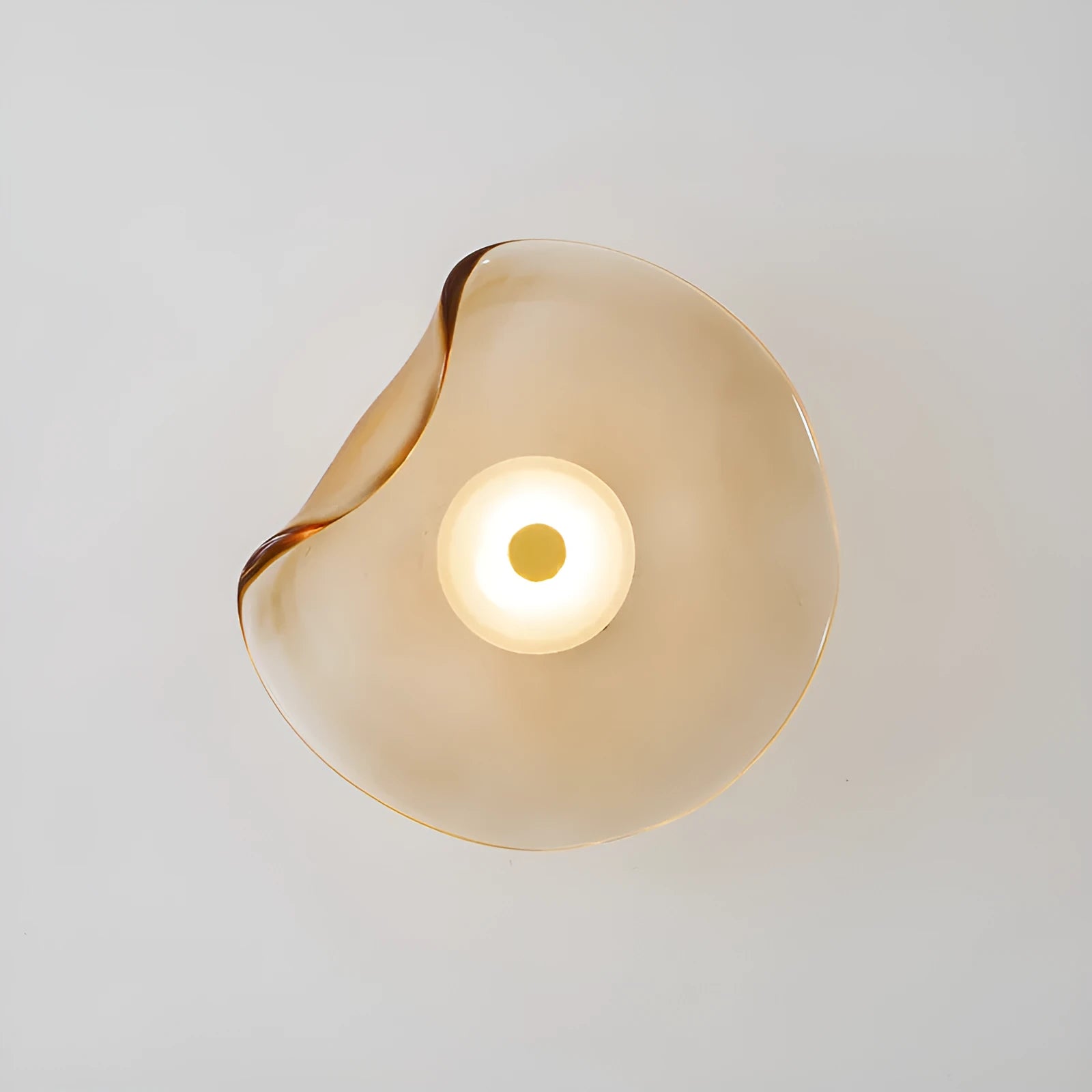 Round decorative wall lamp with glass shade in choice of cognac, light purple, or smoky grey finishes for bedroom lighting