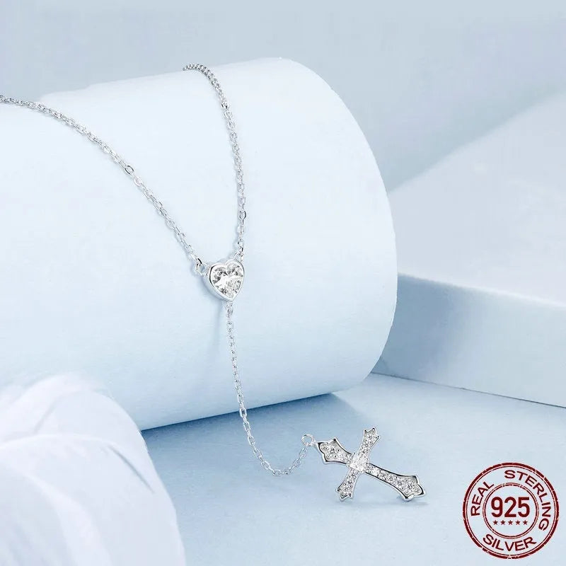 Simple silver love cross pendant on a V-neck O-ring chain, colour BSN384.