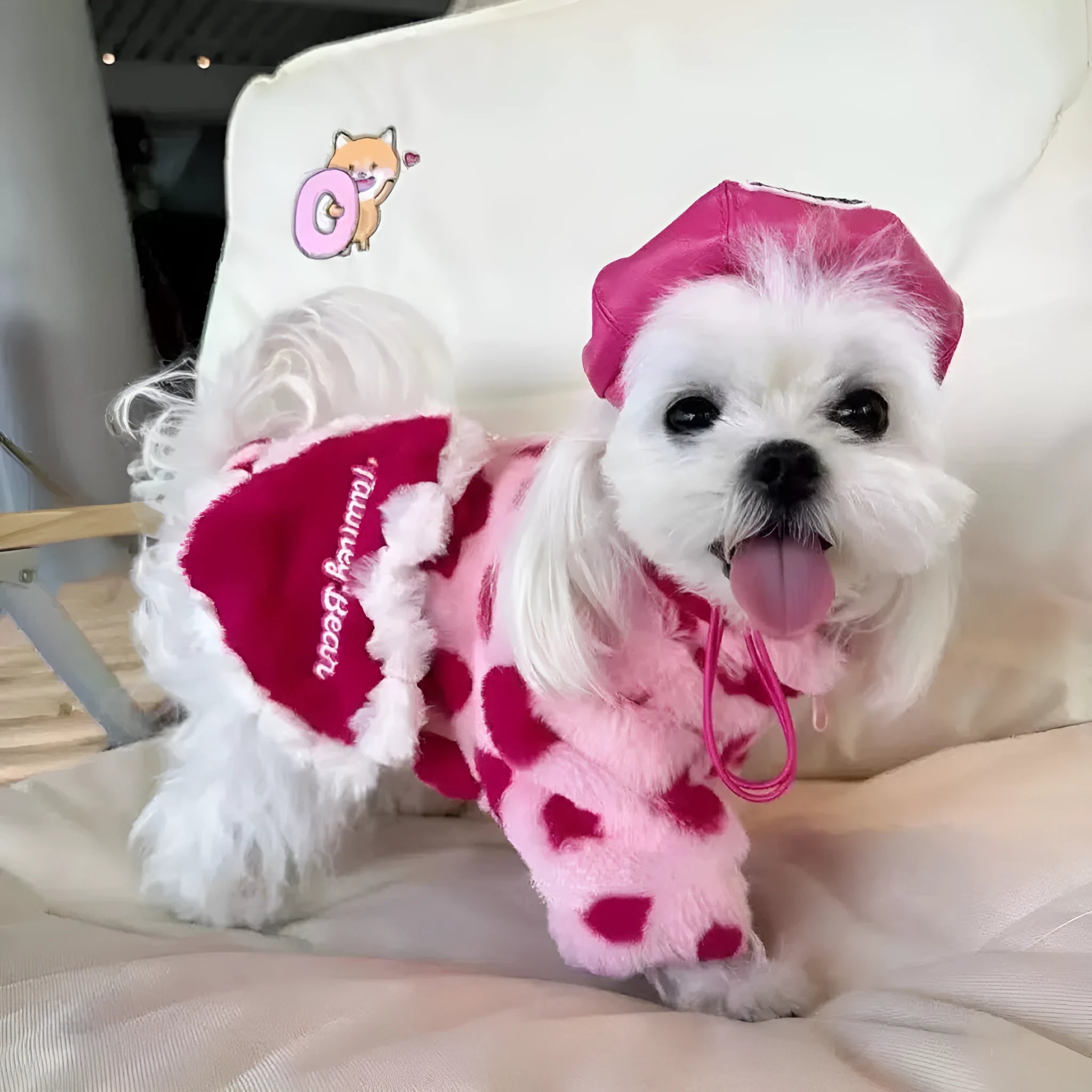Pink and brown plush polyester warm coat for small dog on size chart showing XS S M L XL 2XL
