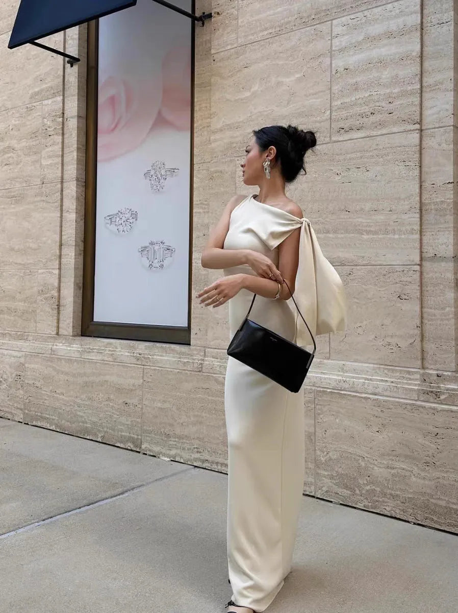 White sloping shoulder high-waist long dress with fold detail from front view