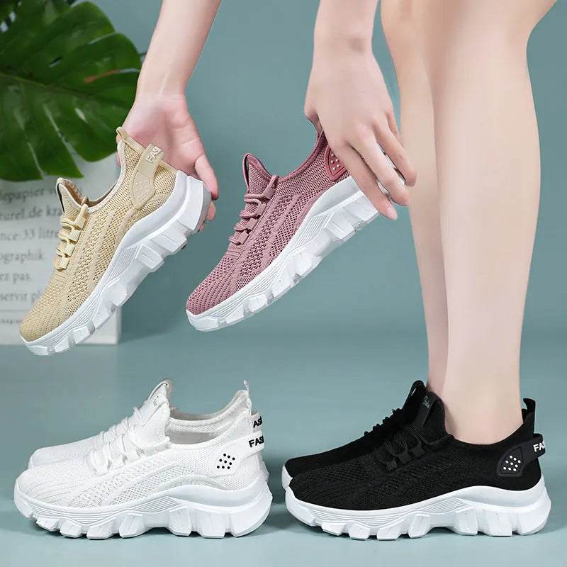 Women's white Flyknit sneaker with thick PVC sole and front lace-up design