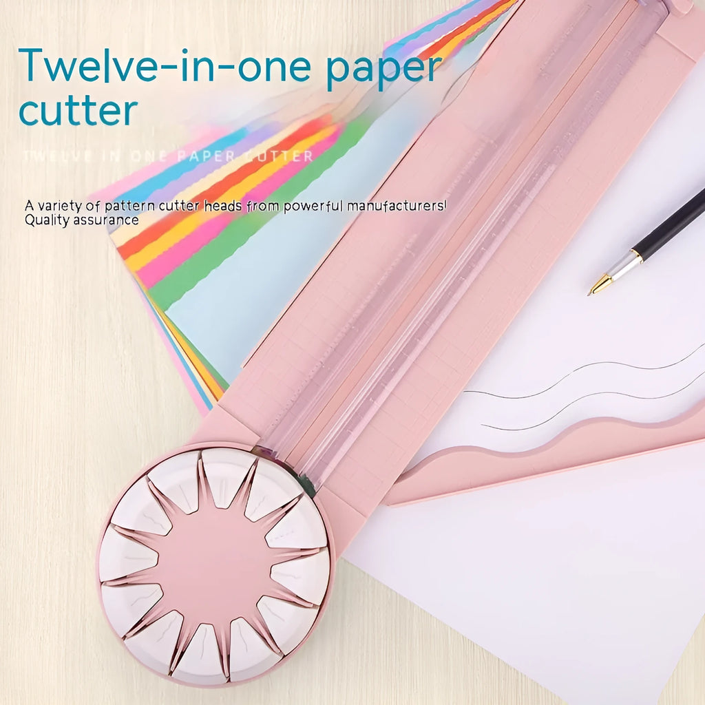 Pink 12-in-1 paper cutting machine with interchangeable blades for scrapbooking on white background