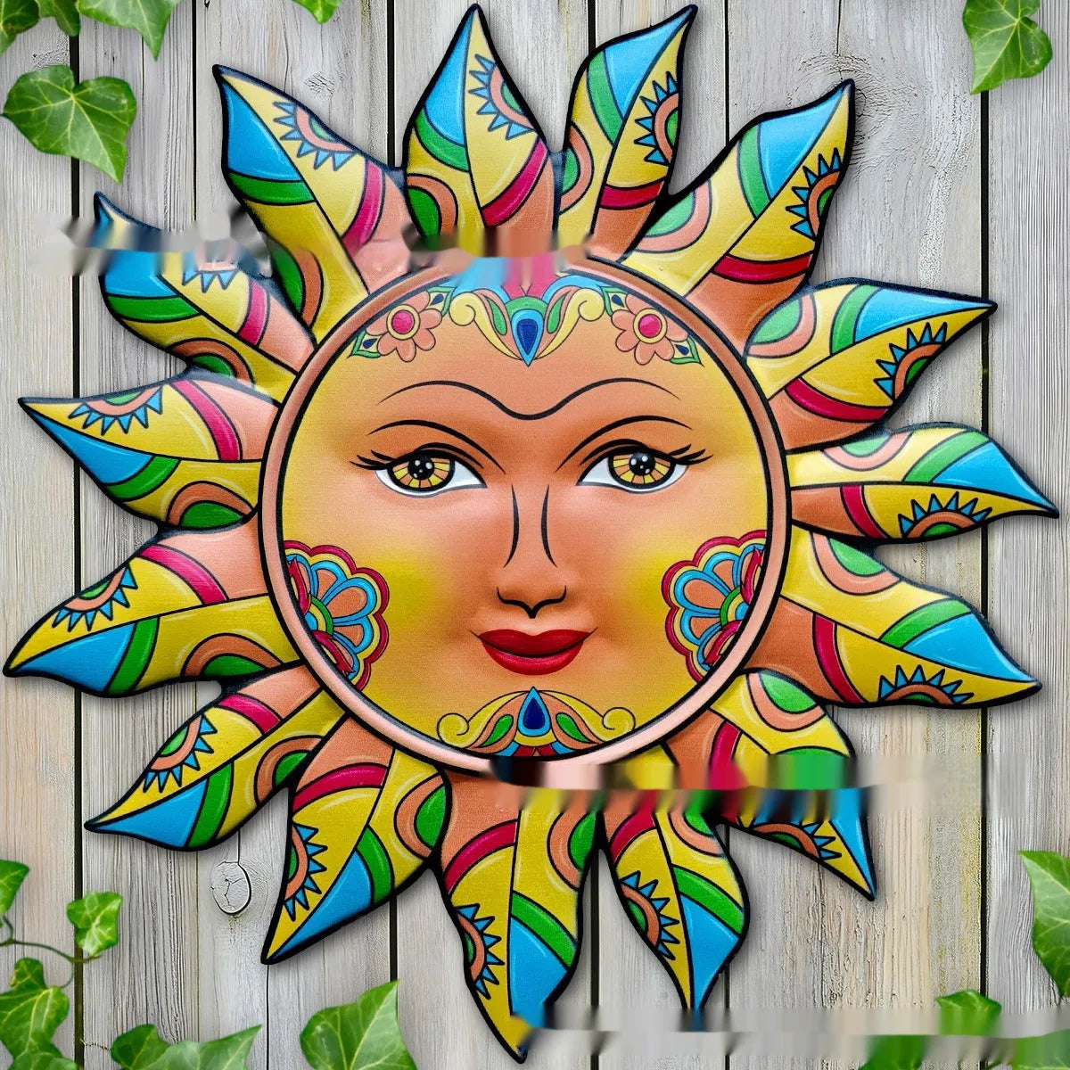 Iron wall hanging featuring a detailed sun face design in one of five available colour finishes.