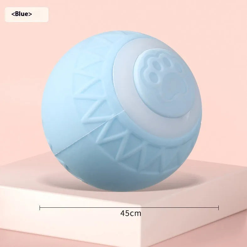 Blue automatic moving ball cat toy with charging cable on flat surface