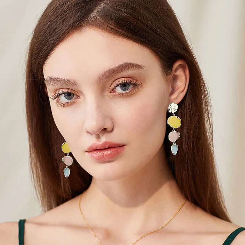 Alloy drop earrings with Morandi colours from oil drip treatment, showing simple vintage disc design.