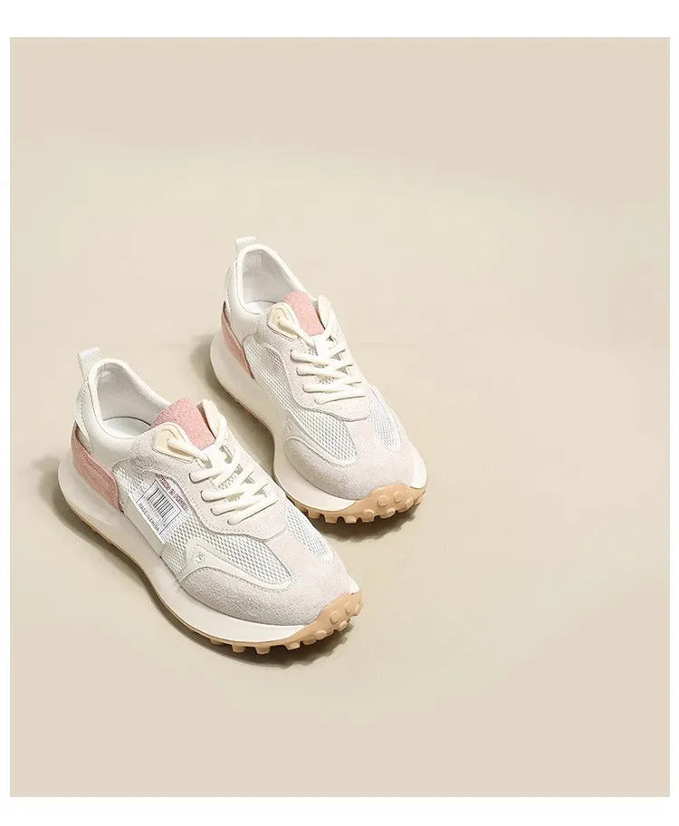 Women's pink and grey retro low-top sneaker with round toe and flat rubber sole.