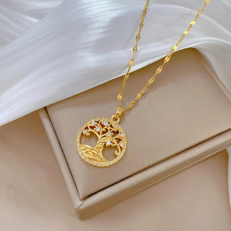 Gold-plated women's necklace with detailed lucky tree pendant featuring zircon stones and mother of pearl shell