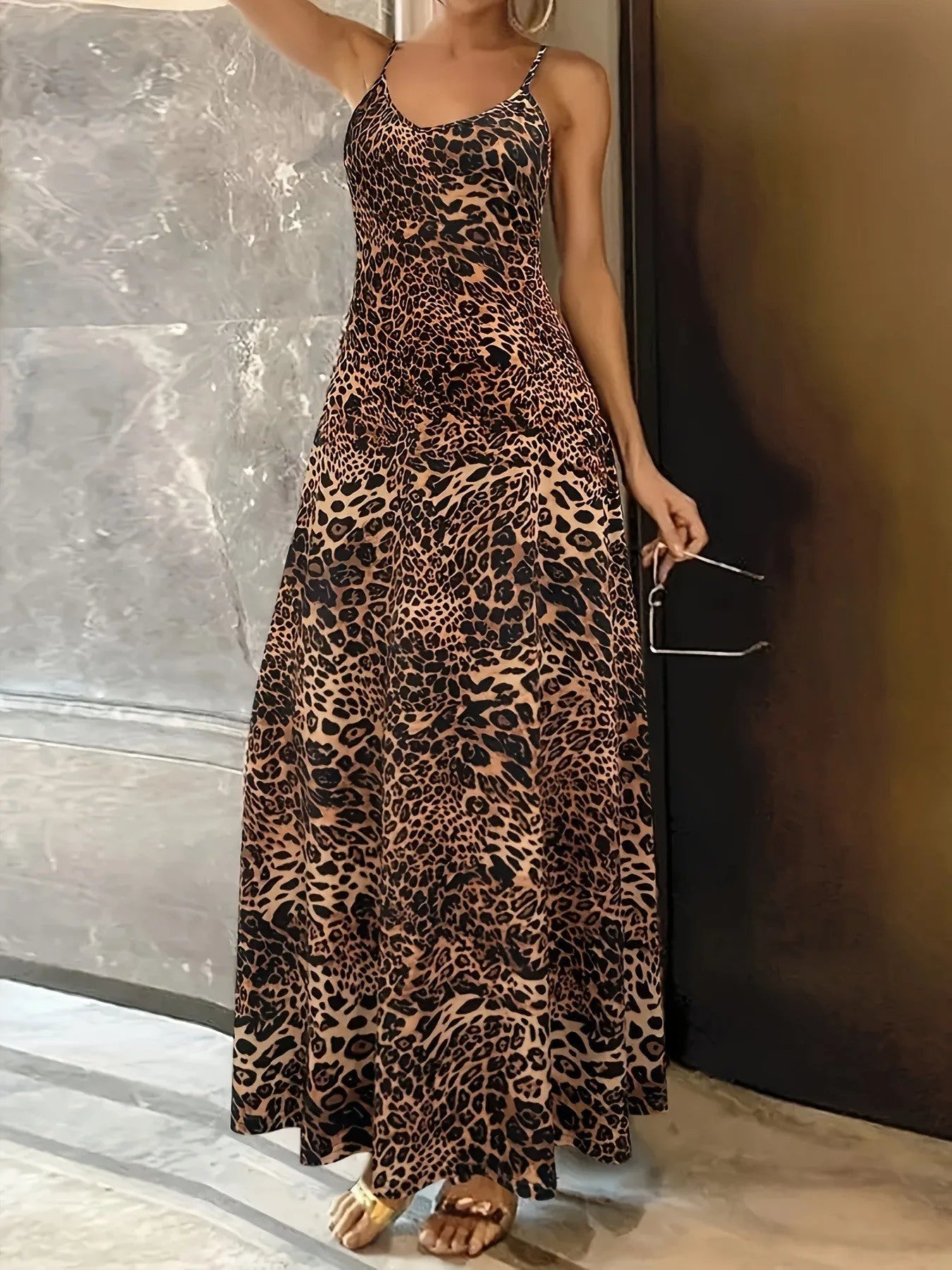 Dark brown leopard print sleeveless dress with round neck and sling straps, made from milk silk polyester fabric.