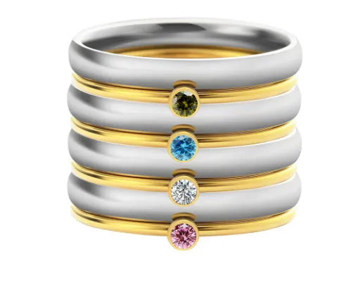 Geometrical titanium steel ring for women with December birthstone colour and superimposed engraving pattern.