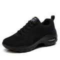 Women's red and black round toe lace-up mesh sneakers with low top and flat mid heel.