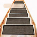 Japanese-style linen-look stair mat in camel colour with a rubber sole on a wooden step.