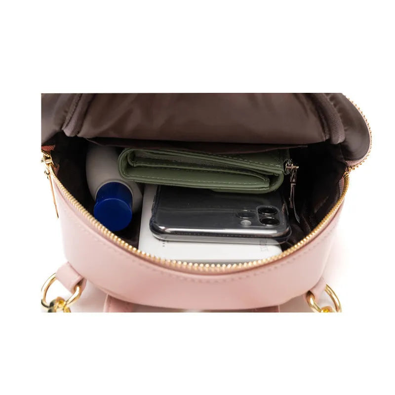 Soft PU leather mini backpack in street-trend style with contrast trim and large capacity.