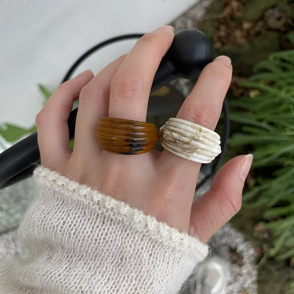 Chinese style irregular geometric resin wide ring in brown and white colours.