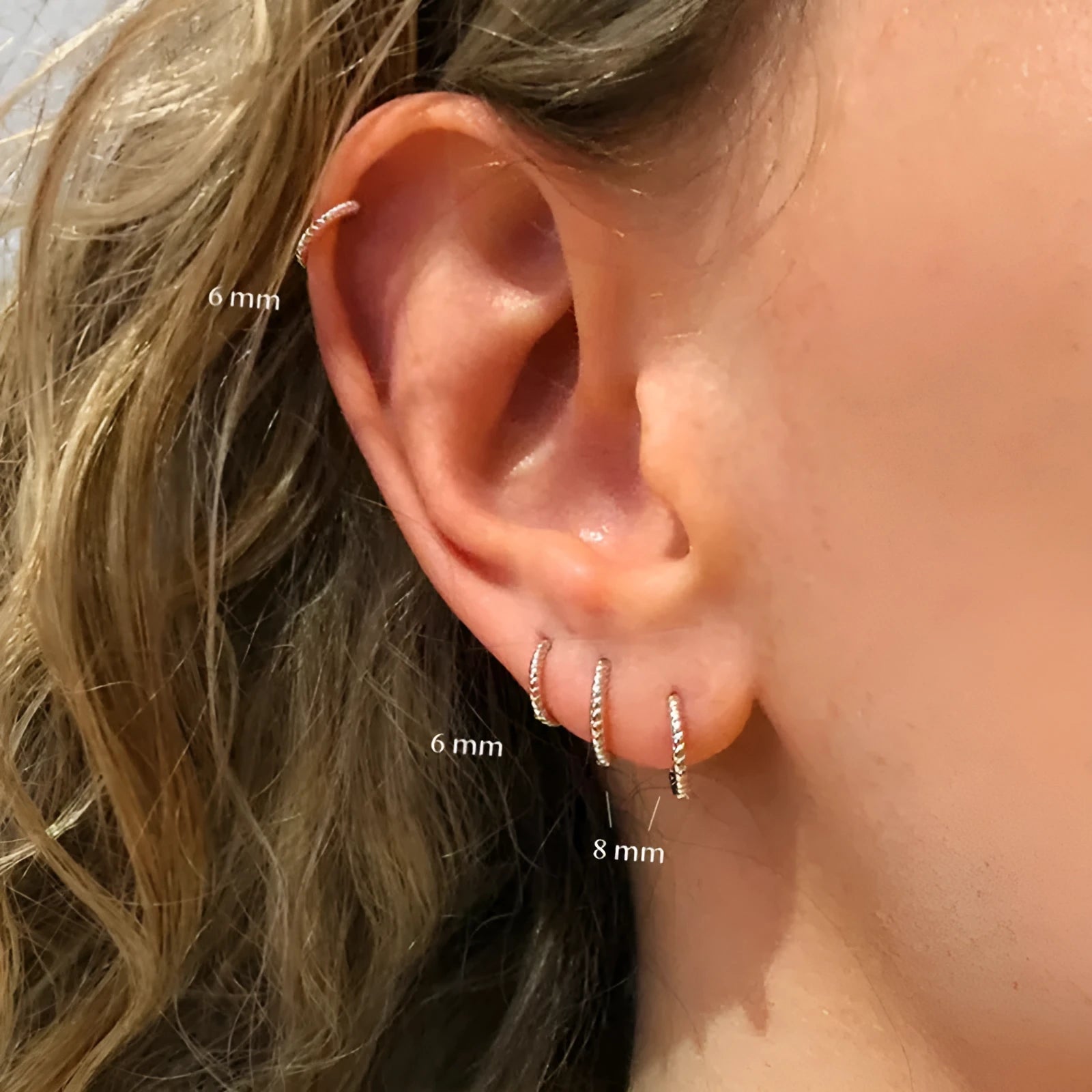 S925 sterling silver twisted string round earrings in gold and white gold finishes showing geometric design