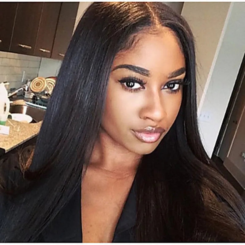 Long straight black synthetic wig with centre part and bangs on a mannequin head