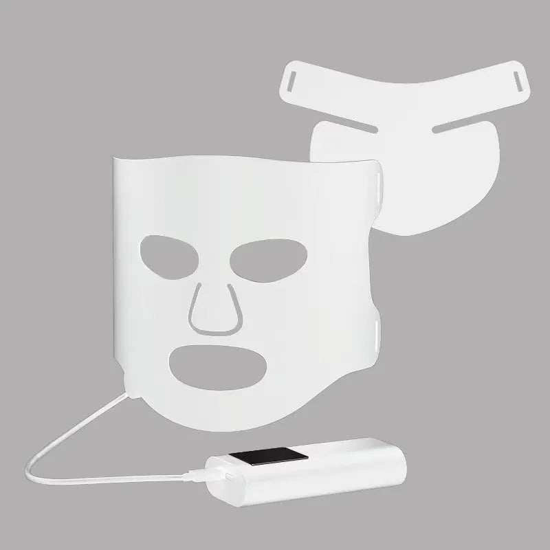 Black and gold LED phototherapy face mask with controller on a white background.