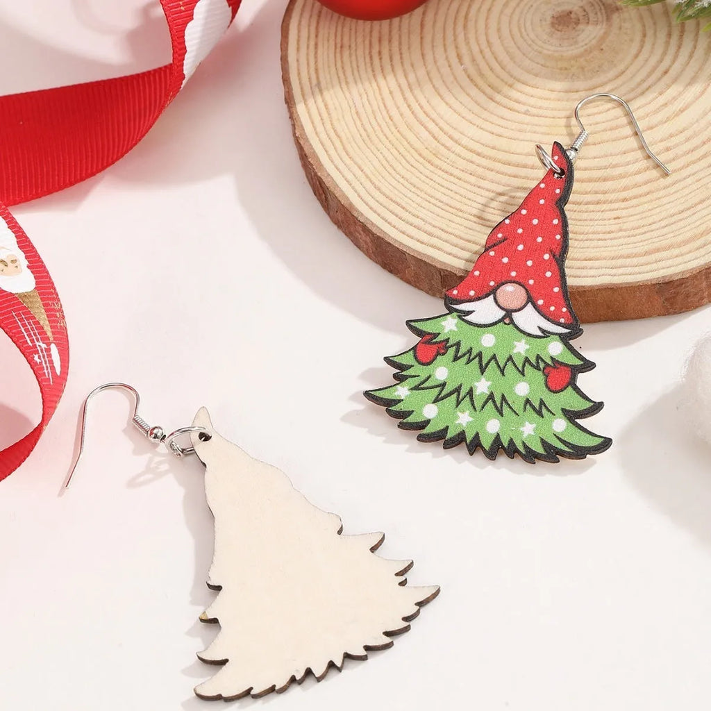 Wooden Christmas earrings with printed tree and snowman designs featuring geometric shapes
