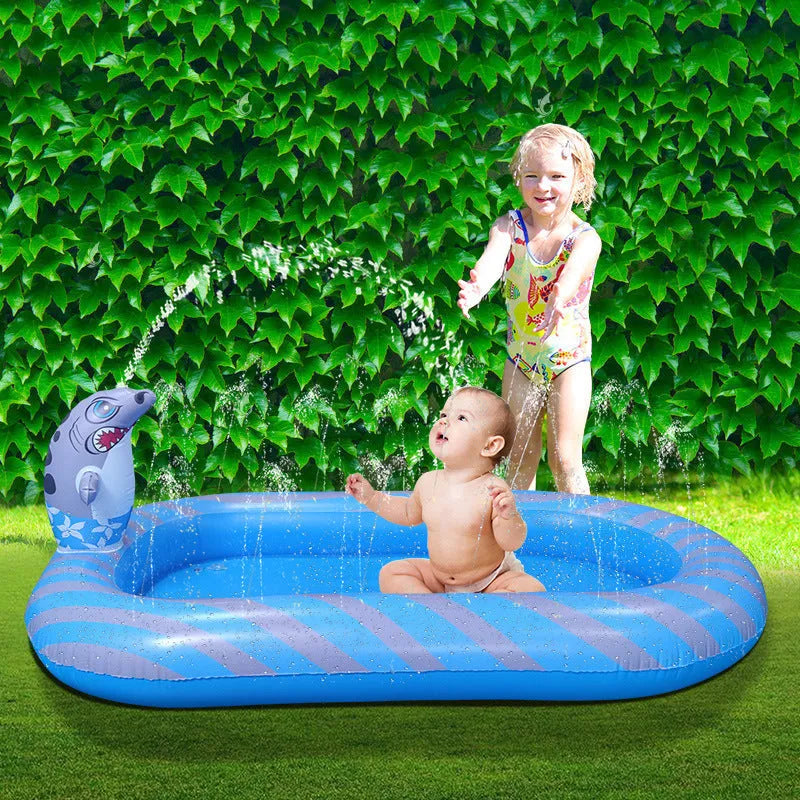 Blue dinosaur and shark inflatable water spray pool with spray feature in garden setting