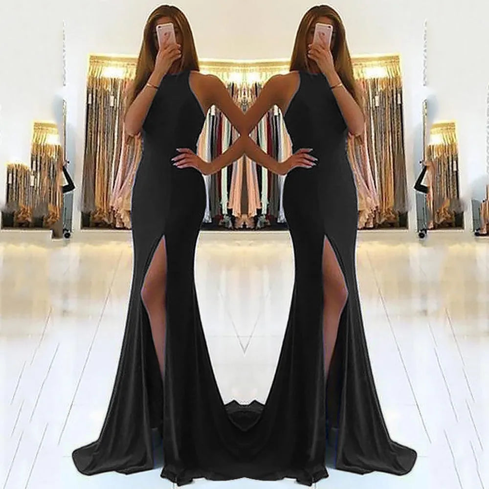 Red long knit evening dress with large swing skirt, high waist, and hollow neck detail on a mannequin.