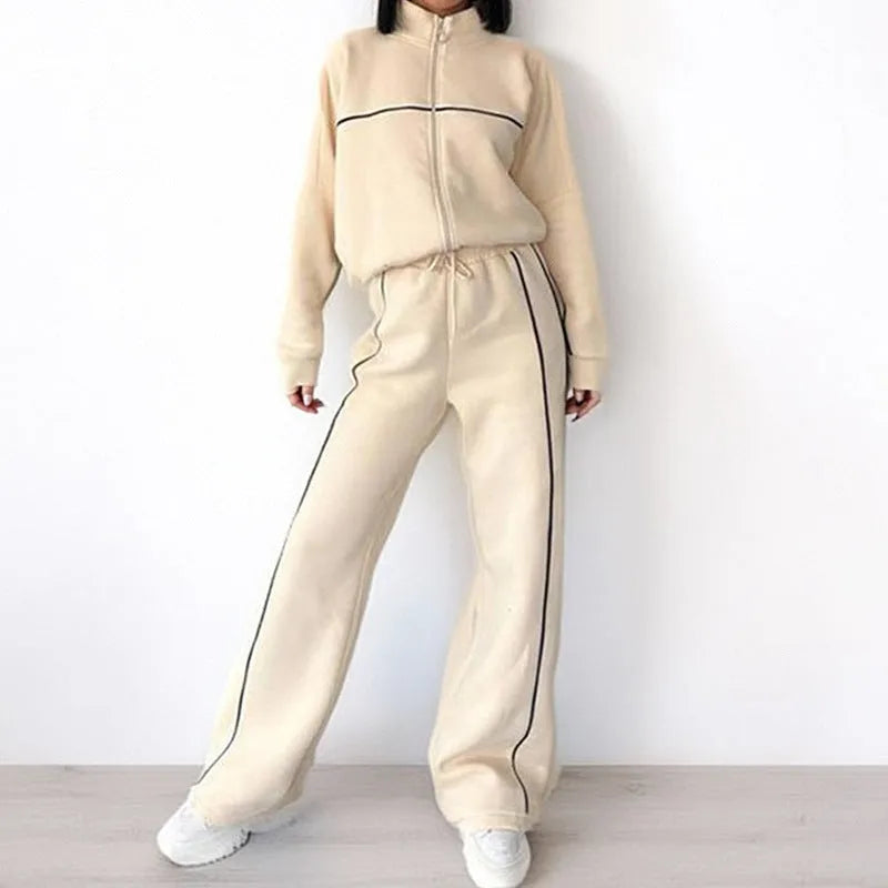 Casual polyester suit with zip hoodie and striped lace-up trousers in apricot colour.