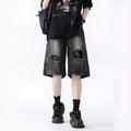 Men's ripped denim shorts with washed finish in black and blue colours showing loose fit design