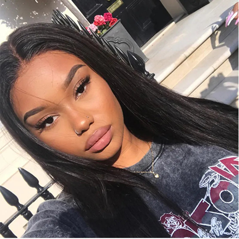Long straight black synthetic wig with centre part and bangs on a mannequin head
