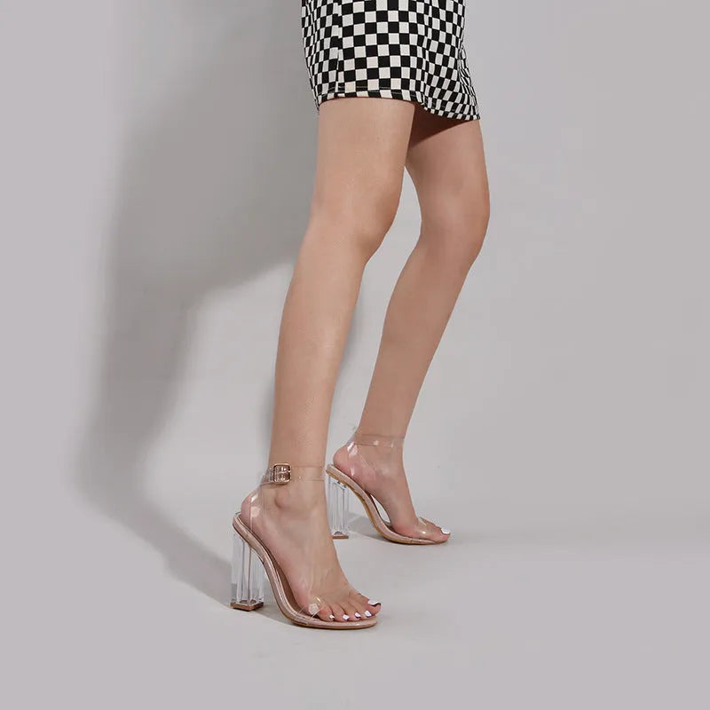 Women's apricot heeled sandals with clear glass heels and buckle closure