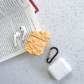 Silicone AirPod case with cartoon animal design in multiple colour options on a table.