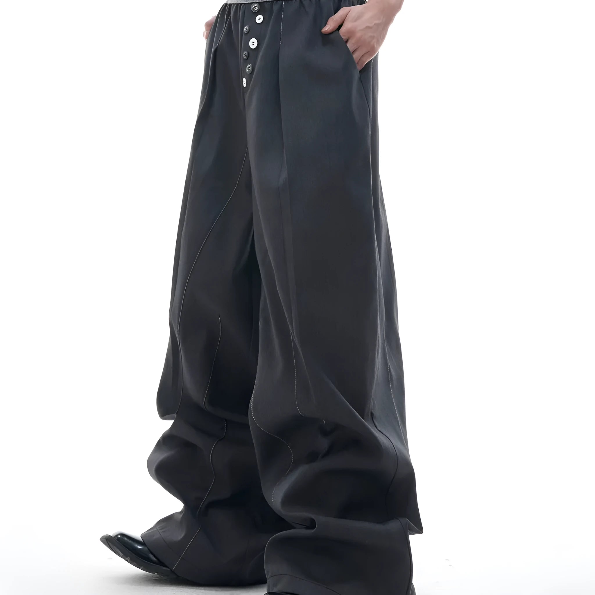 Men's straight-leg casual trousers with drooping design and button detail in black or grey