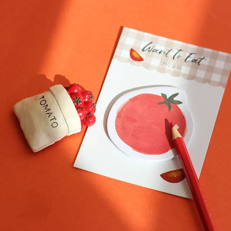 Food-themed memo pad notebook in choice of four colours, showing compact 85mm by 120mm size.