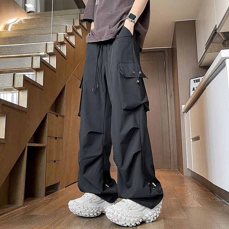 Men's plus size waterproof thin trousers in a straight-leg style with a drawstring waist.
