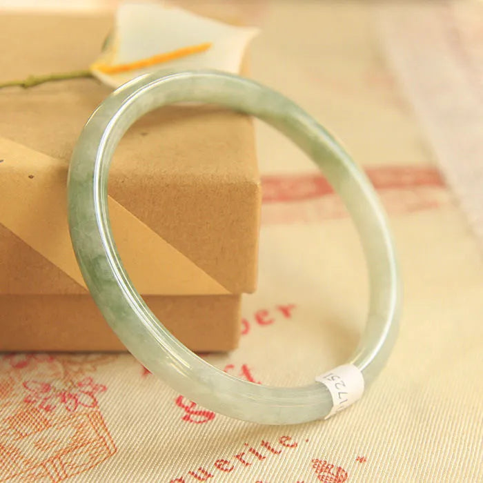 Green jade geometric bracelet with waxy finish, 10mm diameter, Chinese-style design