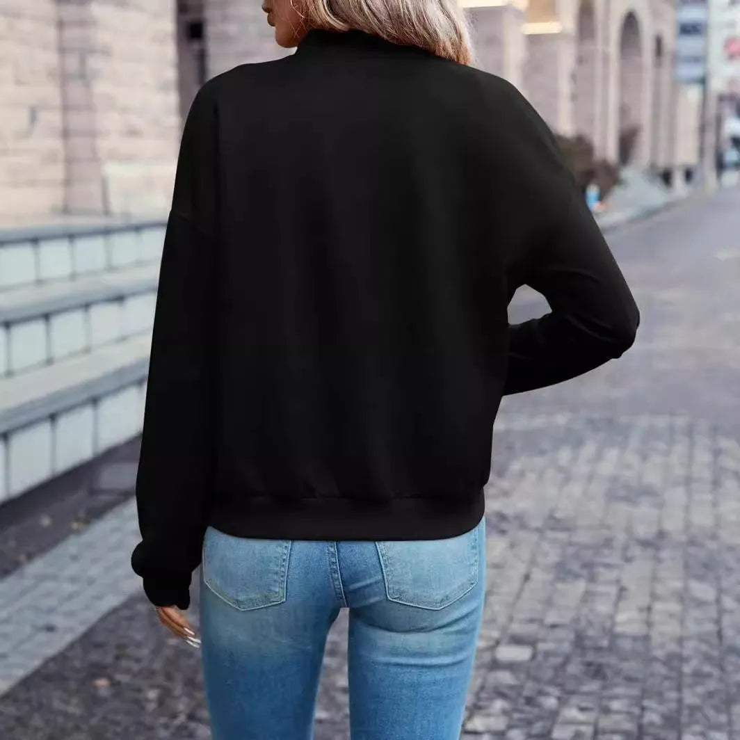 Black women's casual zip jacket with long sleeves and faux pockets on a model.