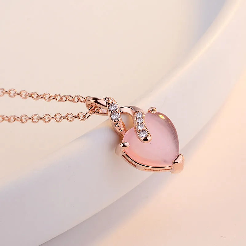 Rose gold heart-shaped crystal pendant necklace with cross chain for women