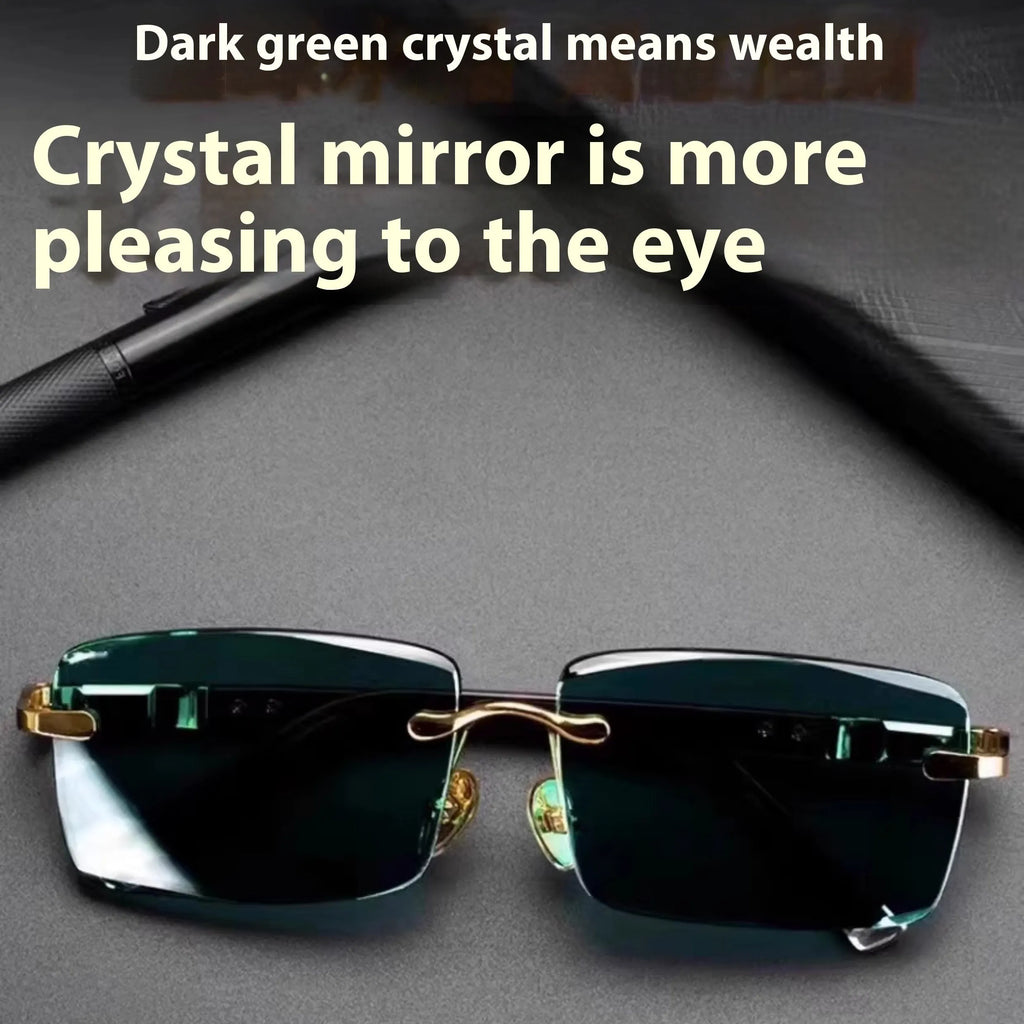 Frameless sunglasses with dark green lenses displayed alongside a protective hard case and cleaning cloth.
