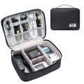 Black waterproof electronics organiser bag open to show mesh pockets, elastic loops and removable padded dividers inside.