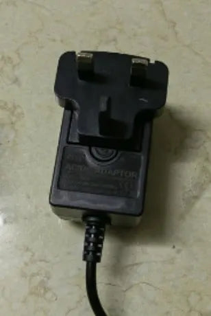 Rechargeable hair clipper for adults and children with stainless steel cutter head, showing EU, UK and US plug options.