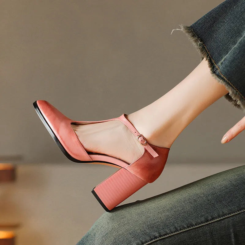Women's dark brown retro Mary Jane shoes with a pointed toe, hollow Baotou detail, and buckle fastening.