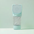 Green 3-in-1 portable pet water bottle with food container and waste bag dispenser