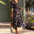Vintage chiffon dress with V-neck and high-waisted A-line skirt in light blue.