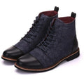 Men's black leather motorcycle boots with silver belt buckle detailing on rugged rubber soles